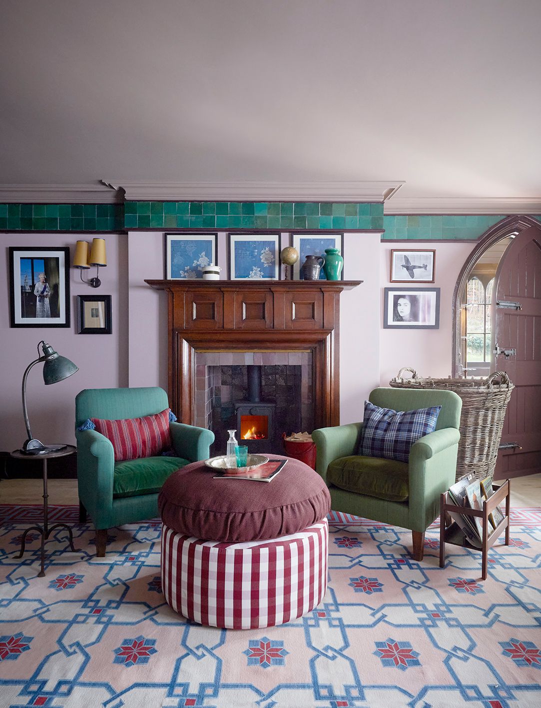 Image may contain Lamp Home Decor Art Painting Furniture Person Cup Chair Rug Plate Couch Desk and Table