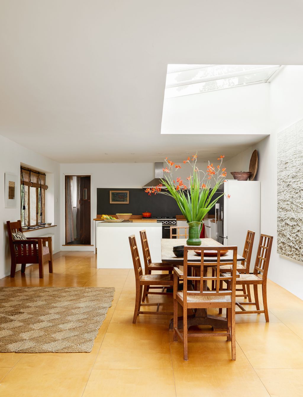 Image may contain Architecture Building Dining Room Dining Table Furniture Indoors Room Table Floor and Flooring