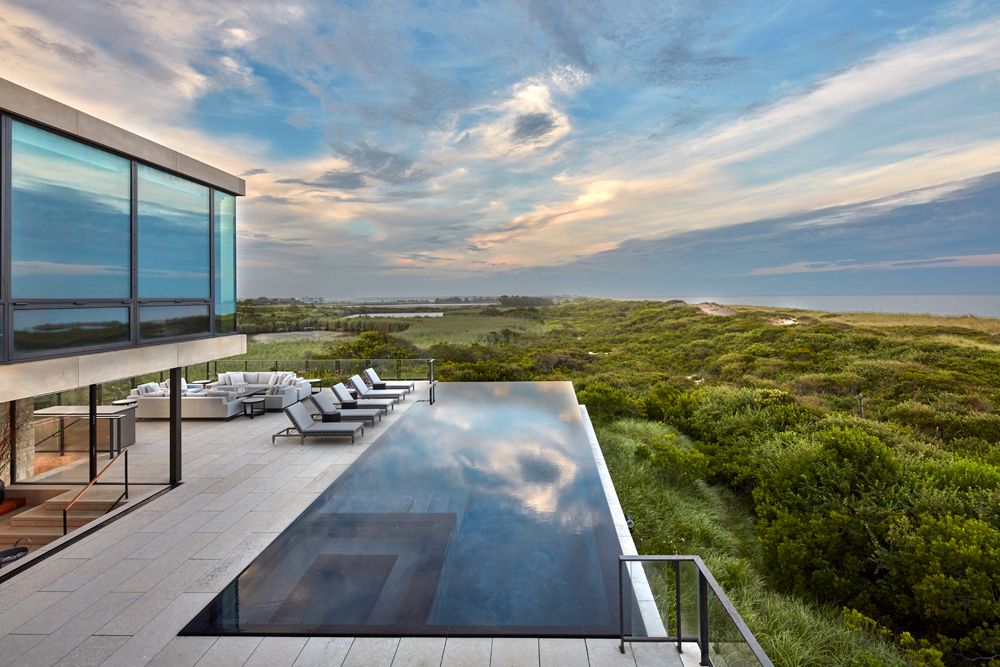 Uninterrupted views and thoughtfully selected materials make this home feel immersed in the landscape. The mezzanines...