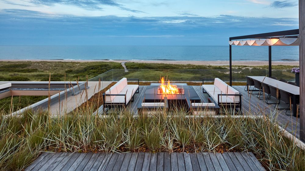 Image may contain Nature Outdoors Scenery Water Waterfront Bench Furniture and Terrace