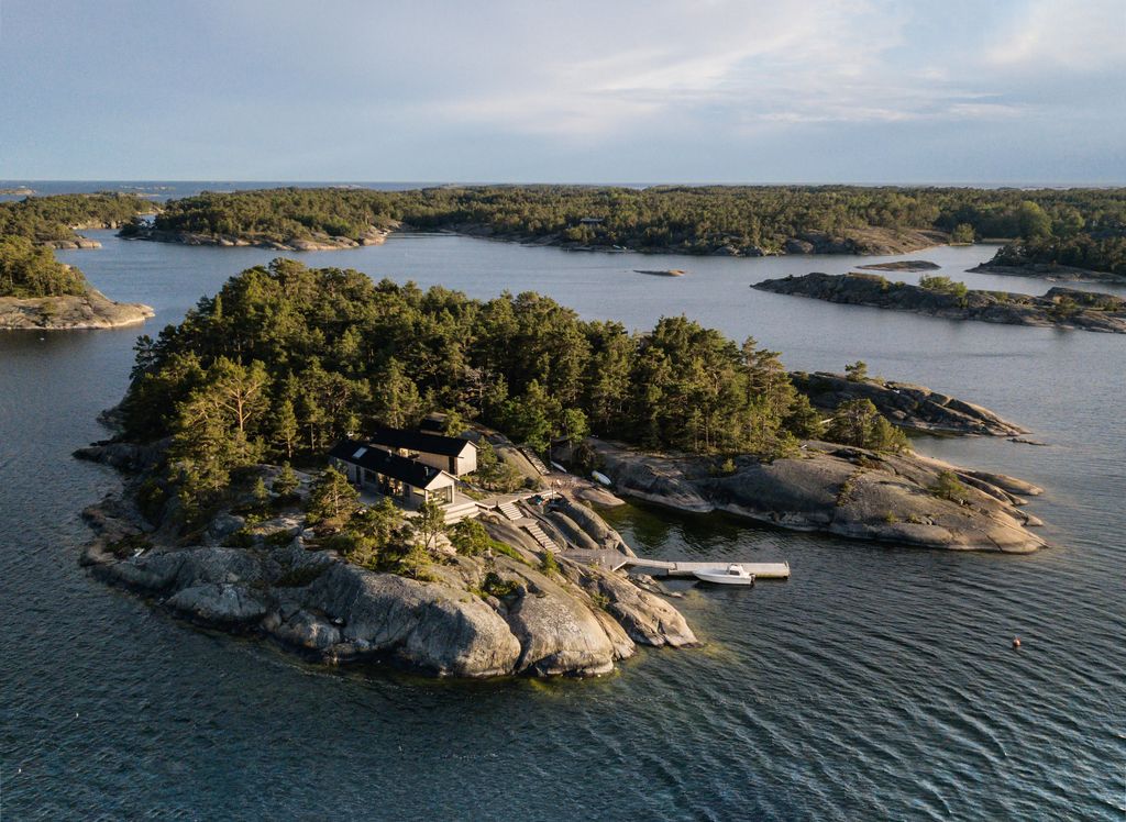 Image may contain Land Nature Outdoors Sea Water Shoreline Coast Boat Transportation Vehicle and Island