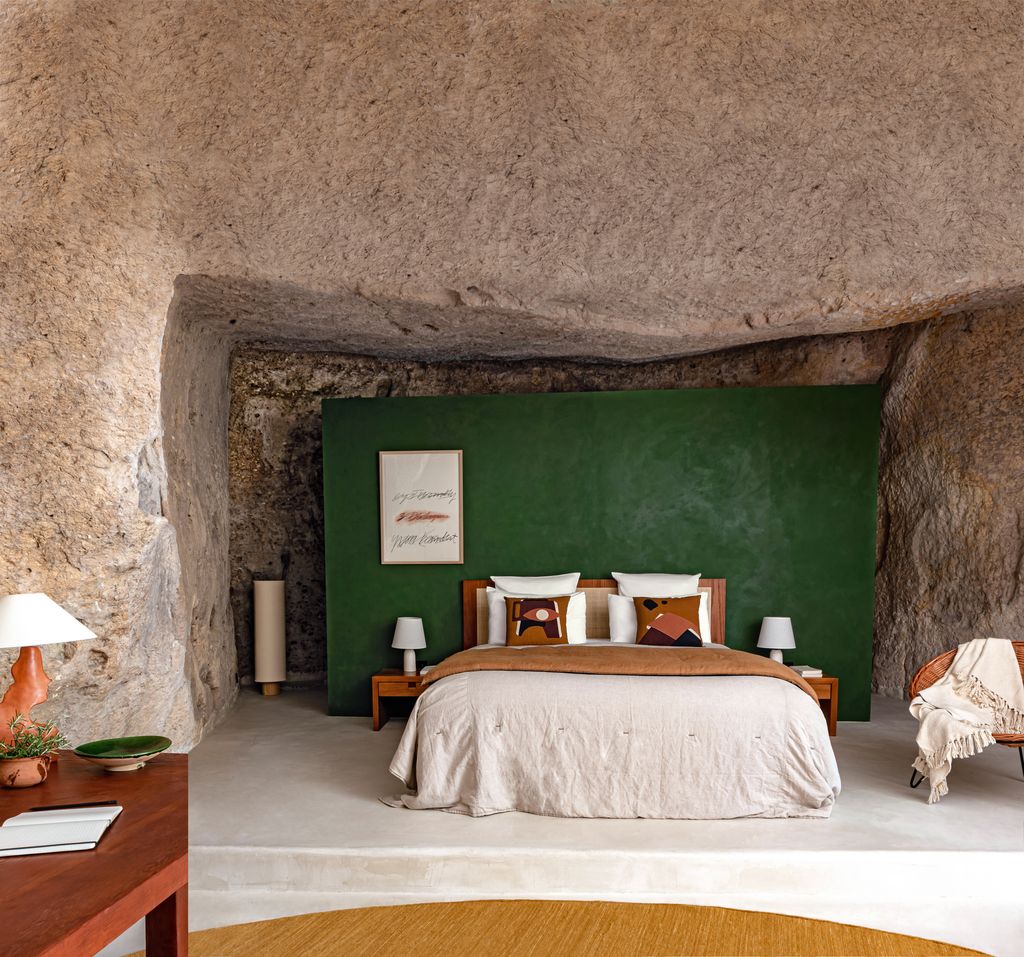 Image may contain Indoors Interior Design Lamp Bed Furniture Home Decor Chair Cushion Plant Bedroom and Room