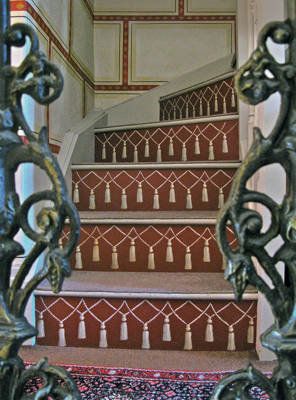 Image may contain Architecture Building House Housing Staircase Handrail Home Decor Rug Accessories and Jewelry