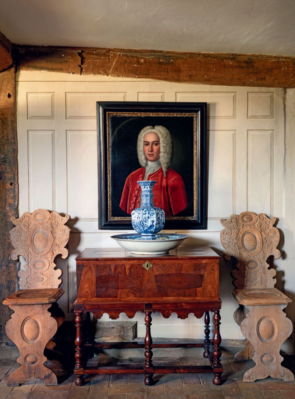 Image may contain Pottery Adult Person Furniture Sideboard Wood Desk Table Chair Art Painting Jar and Altar