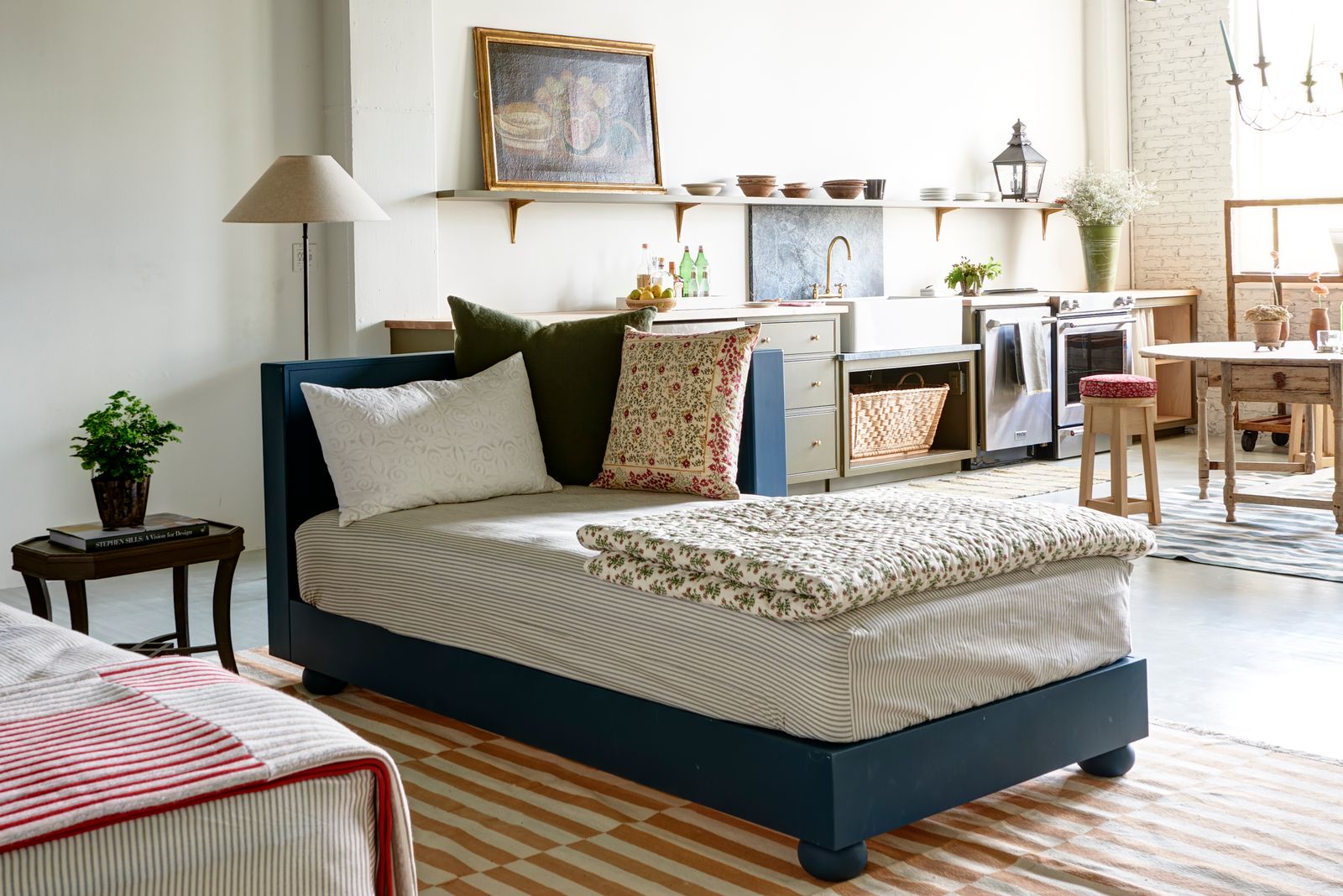 Image may contain Home Decor Plant Cushion Bed Furniture Lamp Art Painting Sink Sink Faucet and Indoors