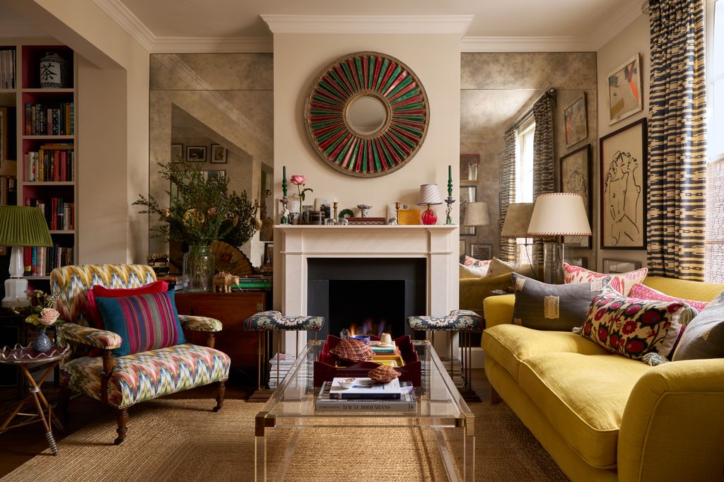 Image may contain Home Decor Couch Furniture Lamp Architecture Building Indoors Living Room Room and Fireplace