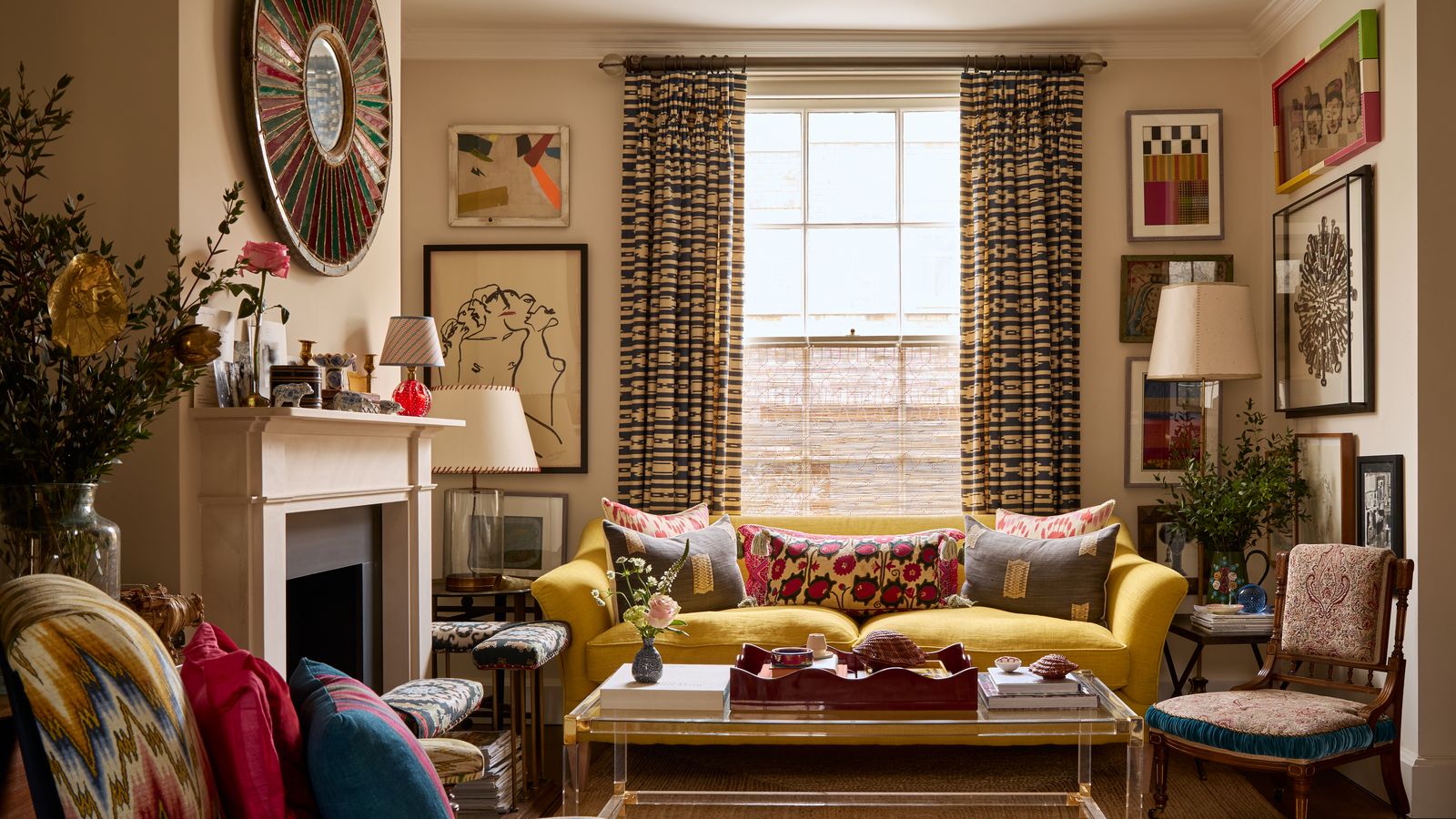 Image may contain: Home Decor, Architecture, Building, Furniture, Indoors, Living Room, Room, Couch, Chair, Lamp, and Plant