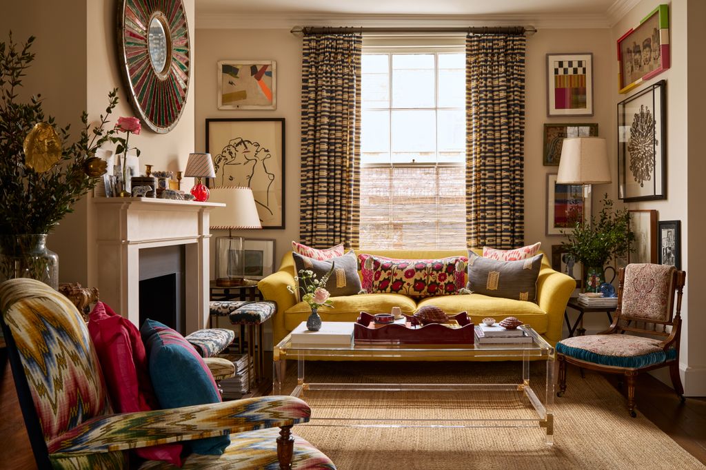 Image may contain Home Decor Architecture Building Furniture Indoors Living Room Room Couch Chair Lamp and Plant