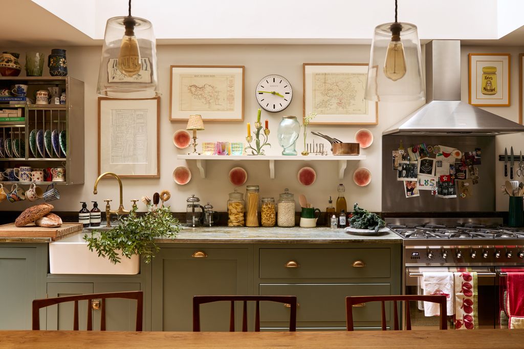 Image may contain Indoors Kitchen Chair Furniture Interior Design Sink Lamp Cooktop Kitchen Island and Cup