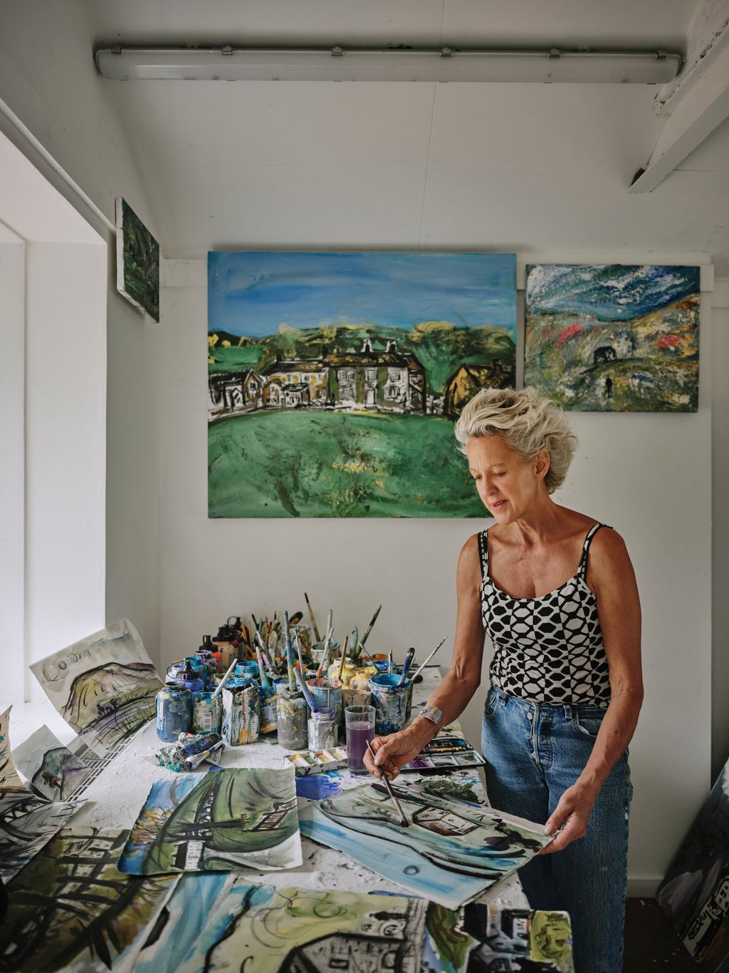 Image may contain Art Painting Clothing Pants Face Head Person Photography Portrait Adult Cup and Furniture