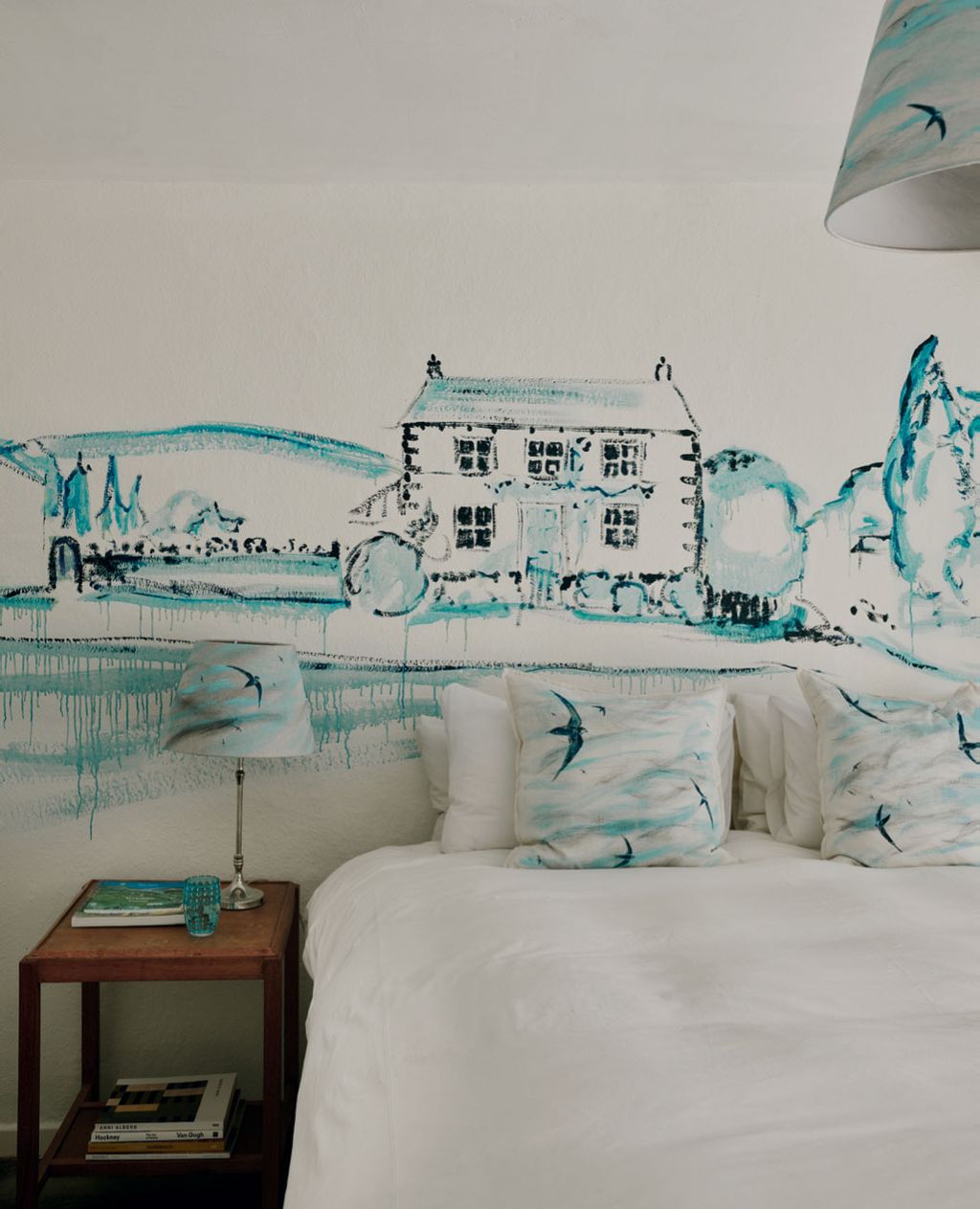 Image may contain Art Painting Lamp Bed Furniture Bedroom Dorm Room Indoors Room Cup Book and Publication