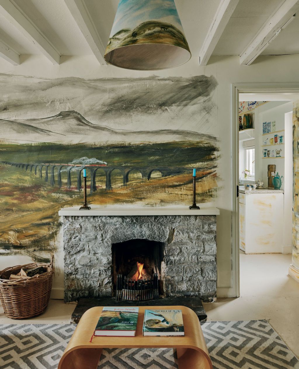 Image may contain Fireplace Indoors Book Publication Hearth Interior Design Home Decor and Rug