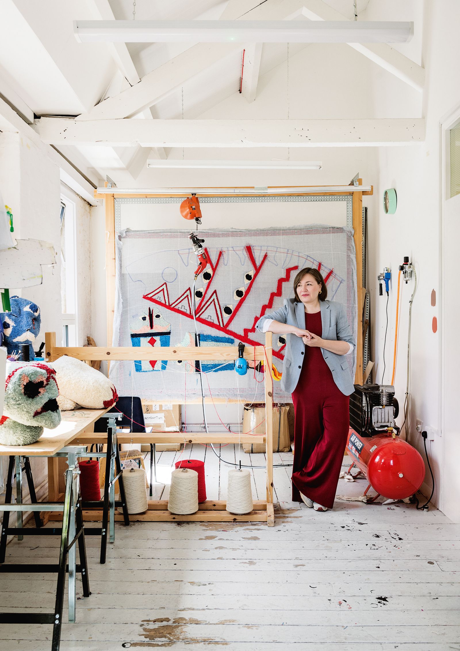 Image may contain Toy Architecture Building Factory Adult Person Manufacturing Workshop Chair Furniture and Desk