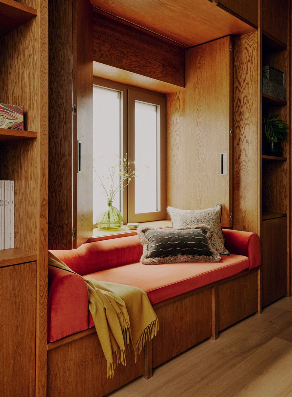 Image may contain Indoors Interior Design Plant Wood Cushion Home Decor Hardwood Stained Wood Window and Couch