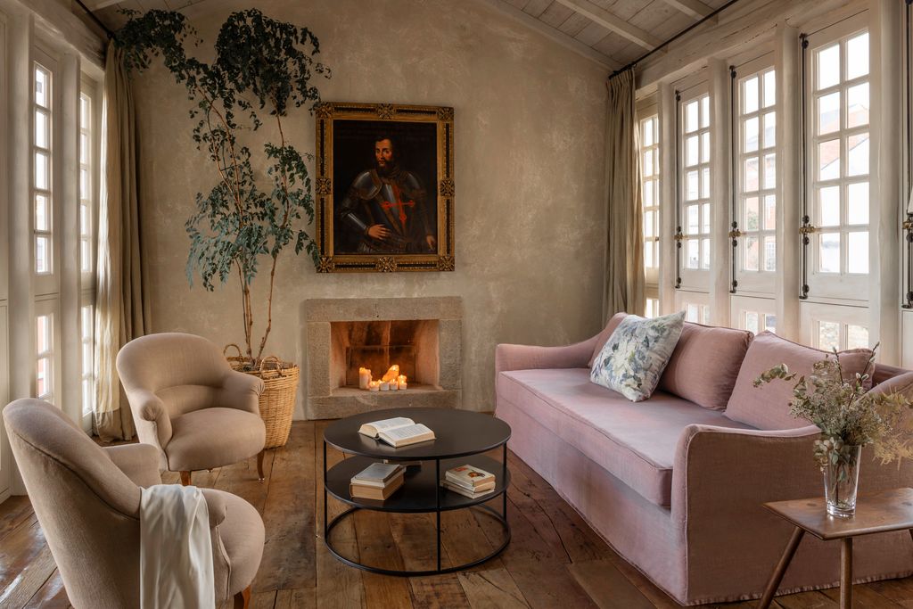 Image may contain Coffee Table Furniture Table Home Decor Plant Couch Chair Architecture Building and Indoors