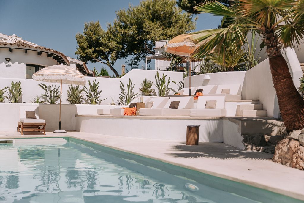 Image may contain Architecture Building House Housing Villa Hotel Resort Pool Water Chair and Furniture