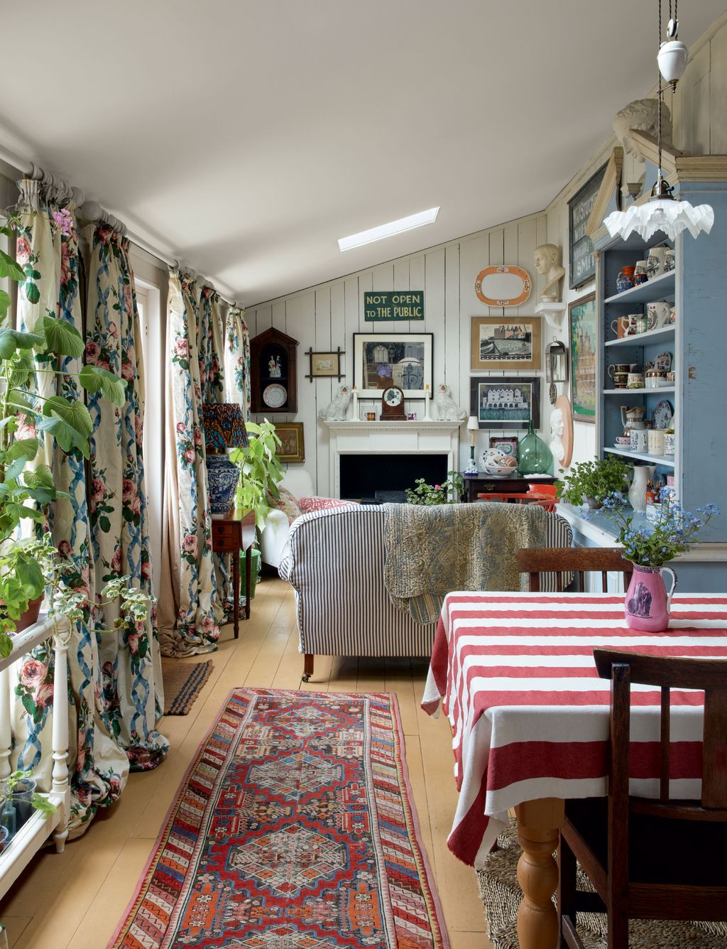 Image may contain Home Decor Chair Furniture Rug Lamp Art Painting Couch Indoors Desk Table and Interior Design