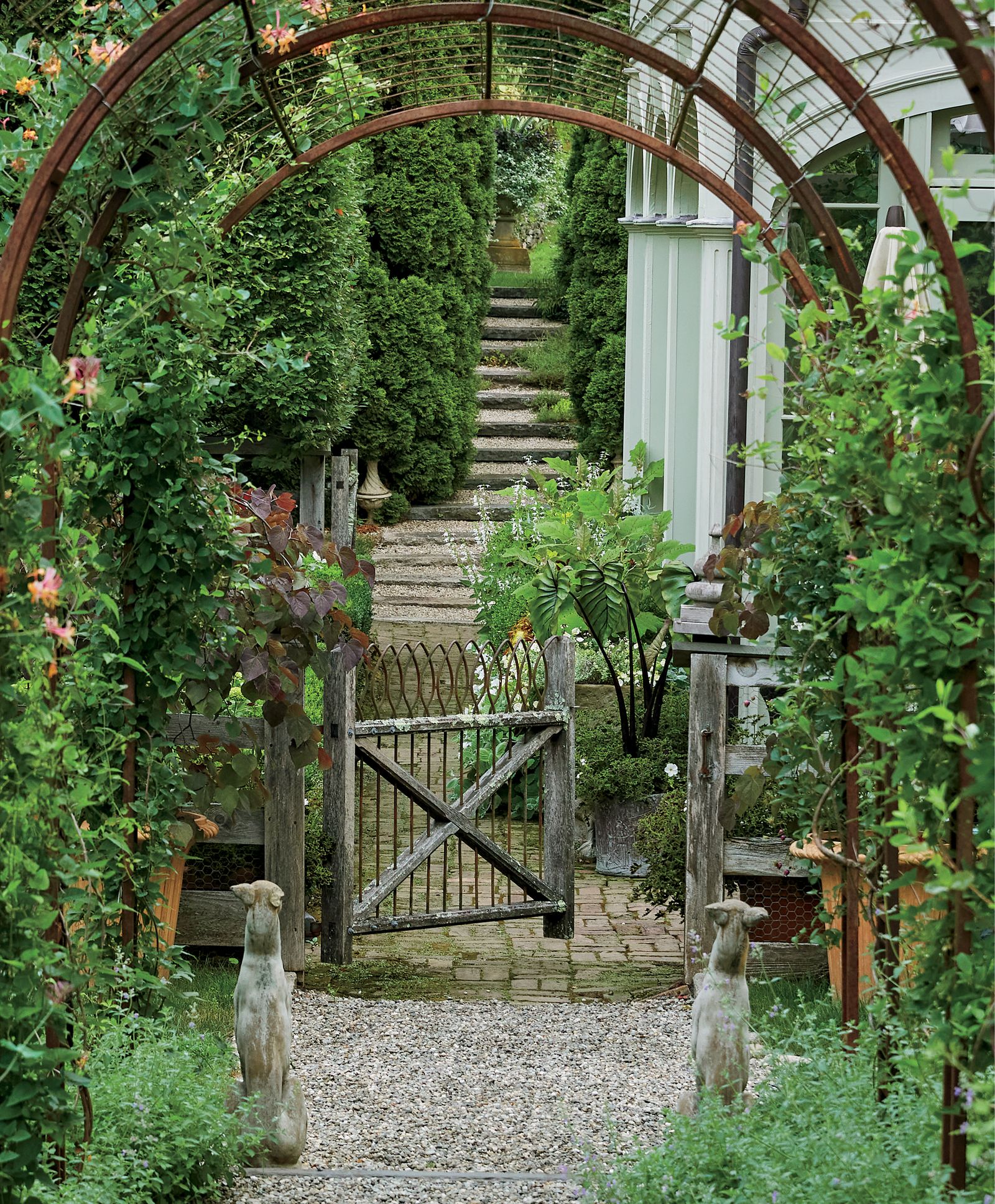 Image may contain Garden Nature Outdoors Arbour Architecture Building House Housing Porch Patio Backyard and Yard