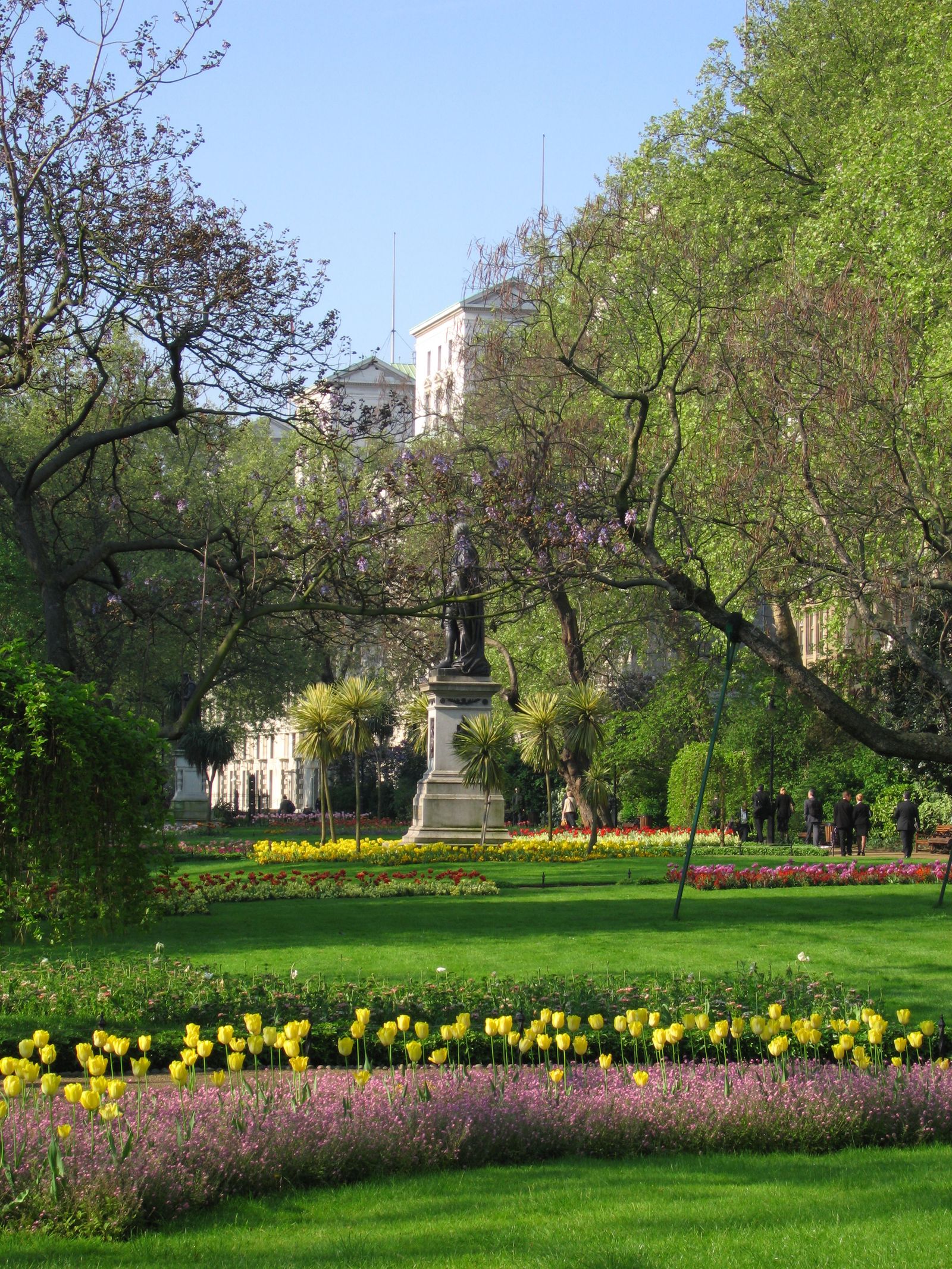 Image may contain Grass Nature Outdoors Park Plant Garden Lawn Grove Land Tree Vegetation Woodland and Person