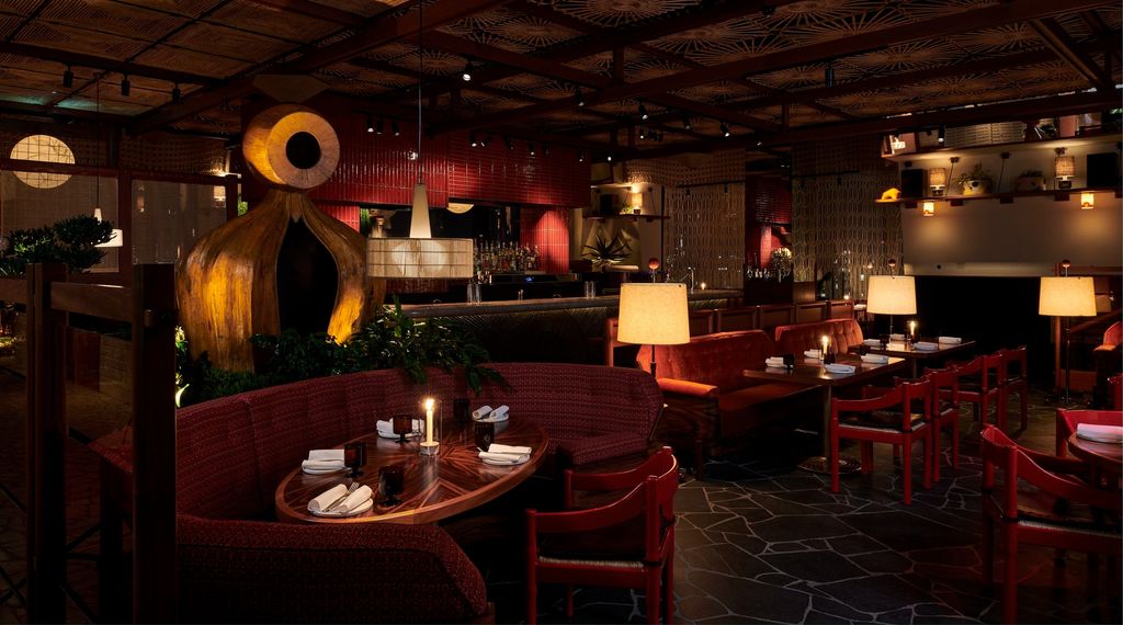 Image may contain Dining Table Furniture Table Indoors Restaurant Chair Lamp Architecture Building and Dining Room