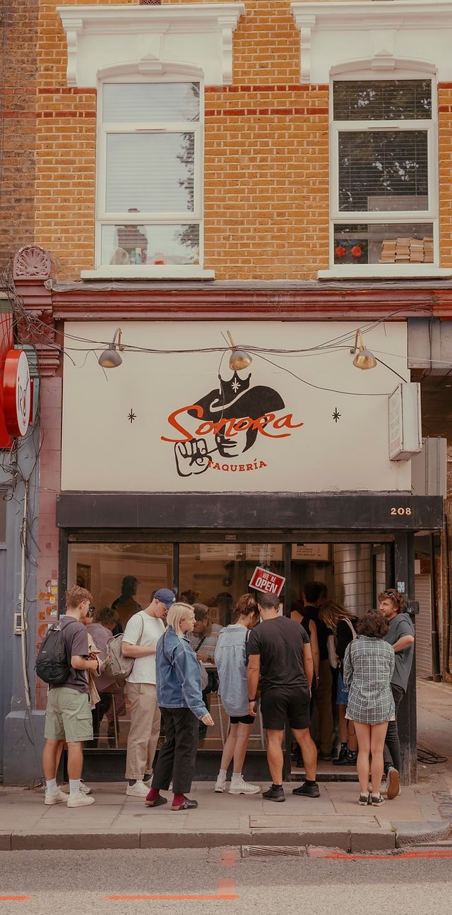 Image may contain Urban City Backpack Bag Clothing Footwear Shoe Person Teen Child Adult Road Street and Hat