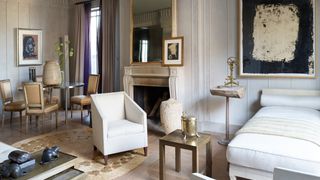 The apartments palette is nearly all white surfaces have been bleached limed and whitewashed. A Richard Serra work on...