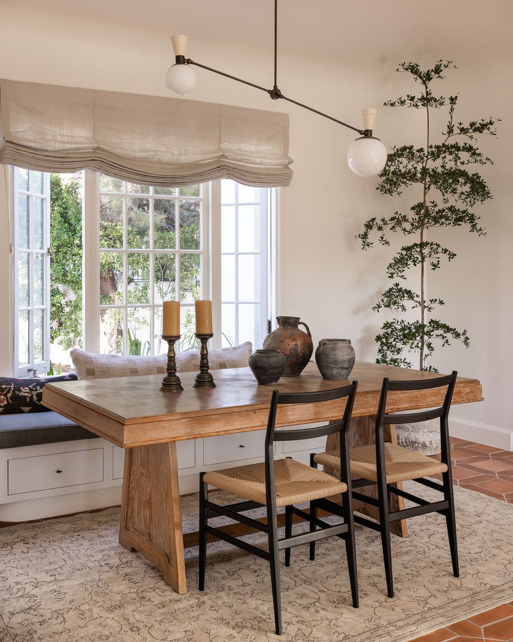 Image may contain Furniture Table Dining Table Architecture Building Dining Room Indoors Room Chair and Desk