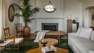 Image may contain Home Decor Plant Chair Furniture Couch Table Indoors Interior Design Architecture and Building