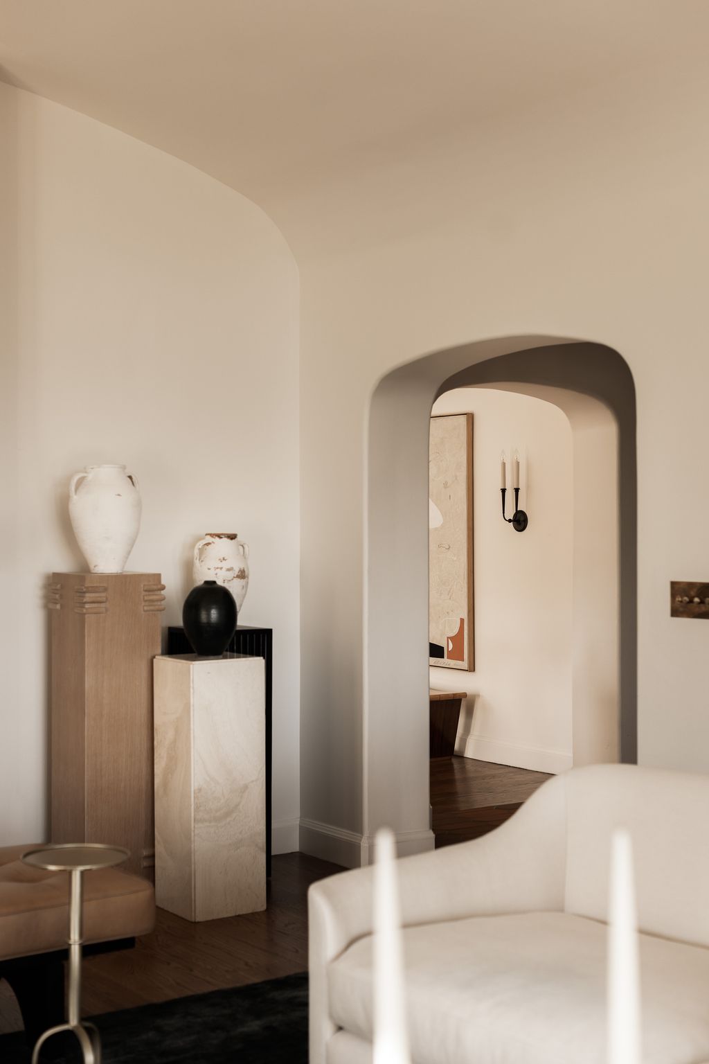 Image may contain Corner Indoors Interior Design Architecture Building Furniture Living Room Room Couch and Arch