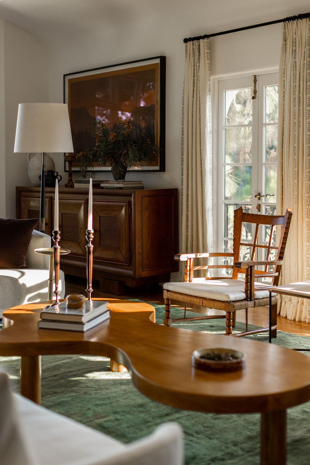 Image may contain Lamp Chair Furniture Architecture Building Indoors Living Room Room Table Lamp and Table