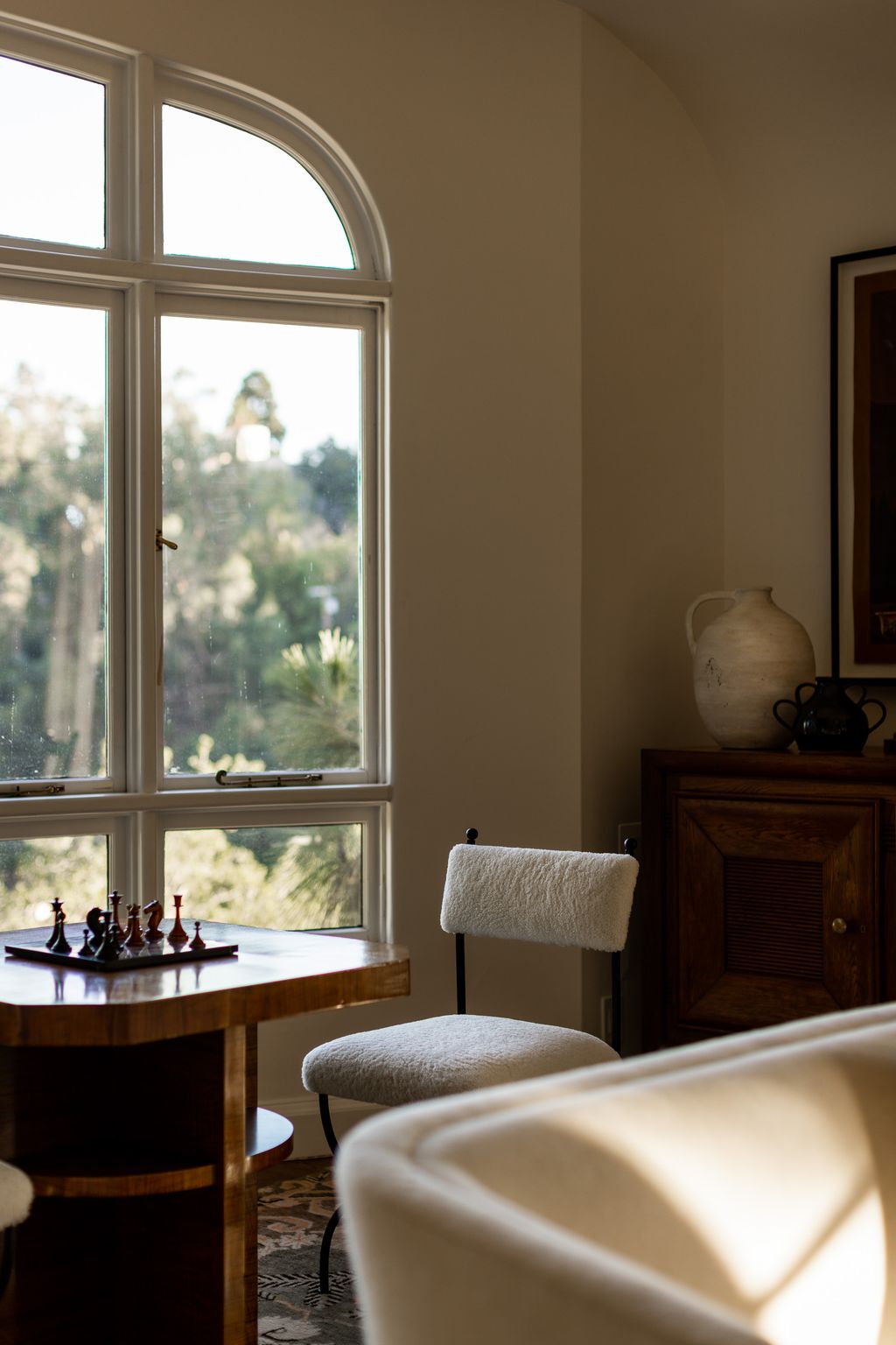 Image may contain Chair Furniture Desk Table Indoors Interior Design Window Architecture Building and Living Room