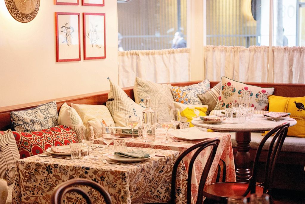 Image may contain Home Decor Furniture Table Couch Cushion Architecture Building Indoors Living Room and Room