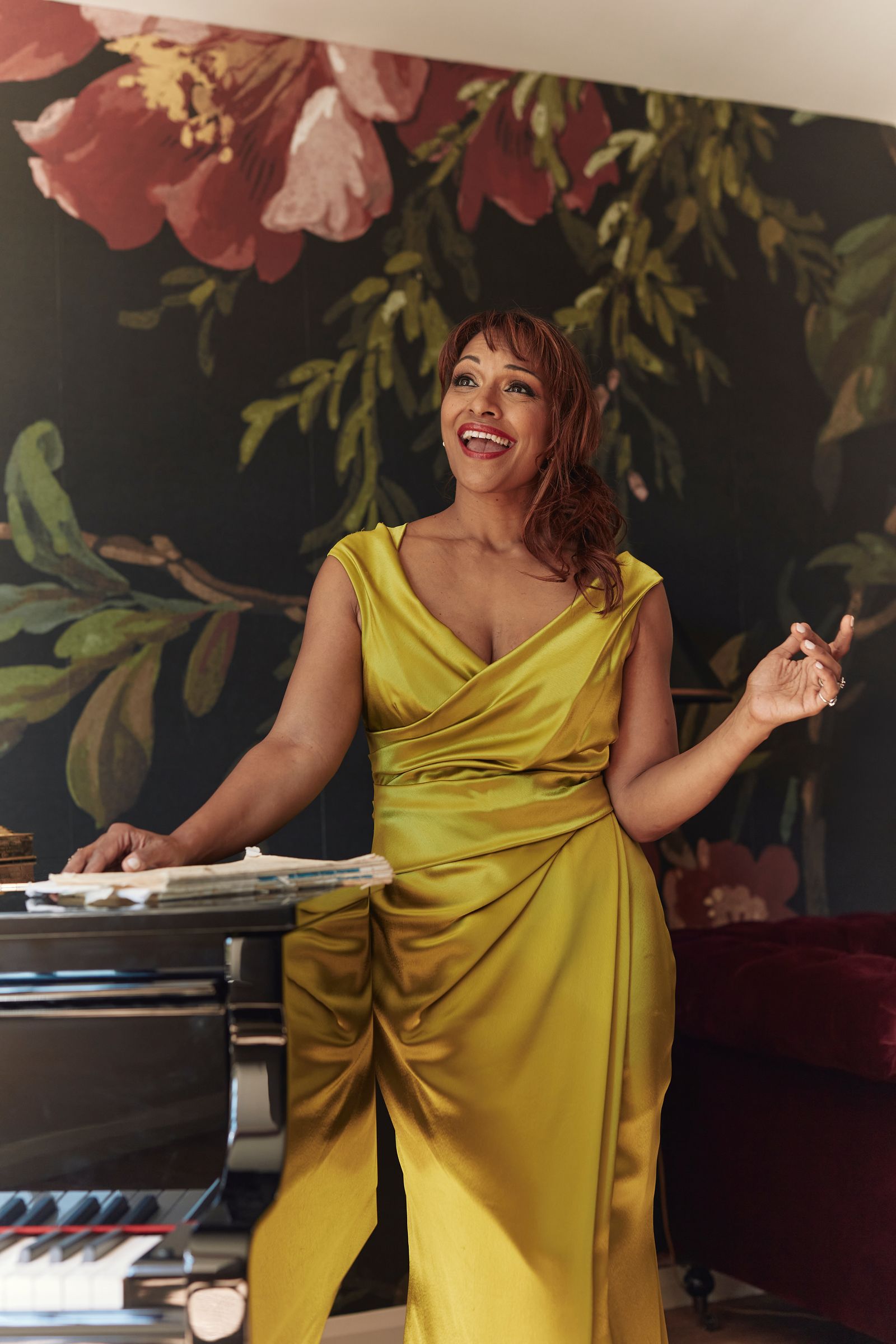 Image may contain Danielle de Niese Clothing Dress Adult Person Head Face Happy Photography and Portrait