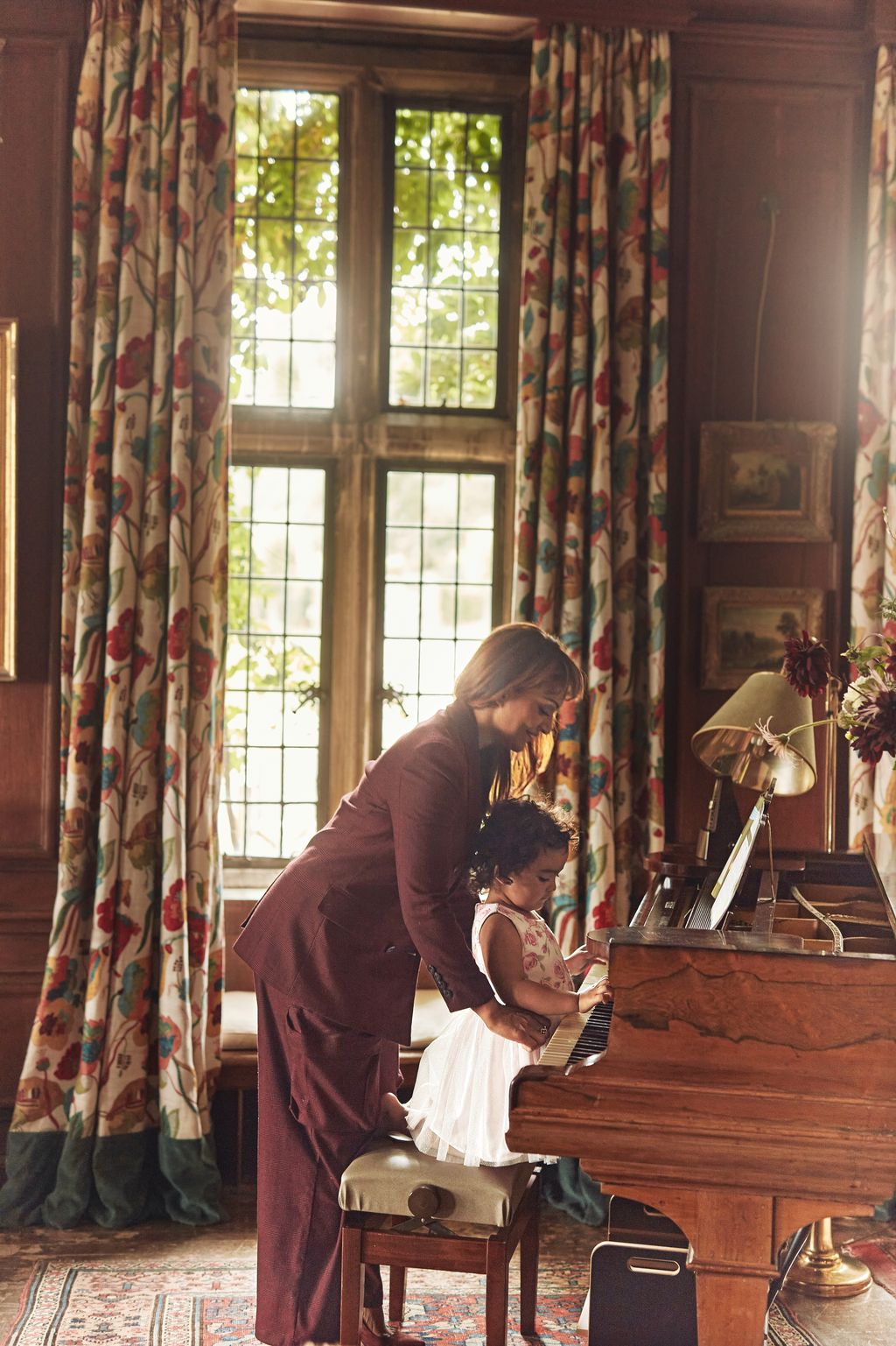 Image may contain Keyboard Musical Instrument Piano Indoors Interior Design Adult Person Face Head and Photography