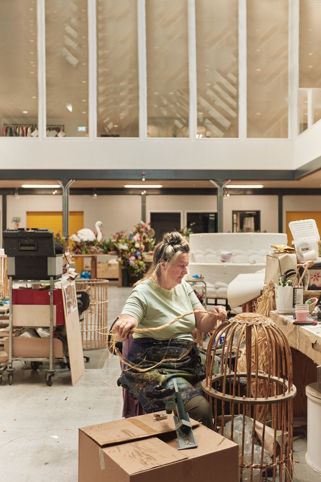 Image may contain Adult Person Box Indoors Furniture Accessories Bag Handbag Cup Animal and Bird