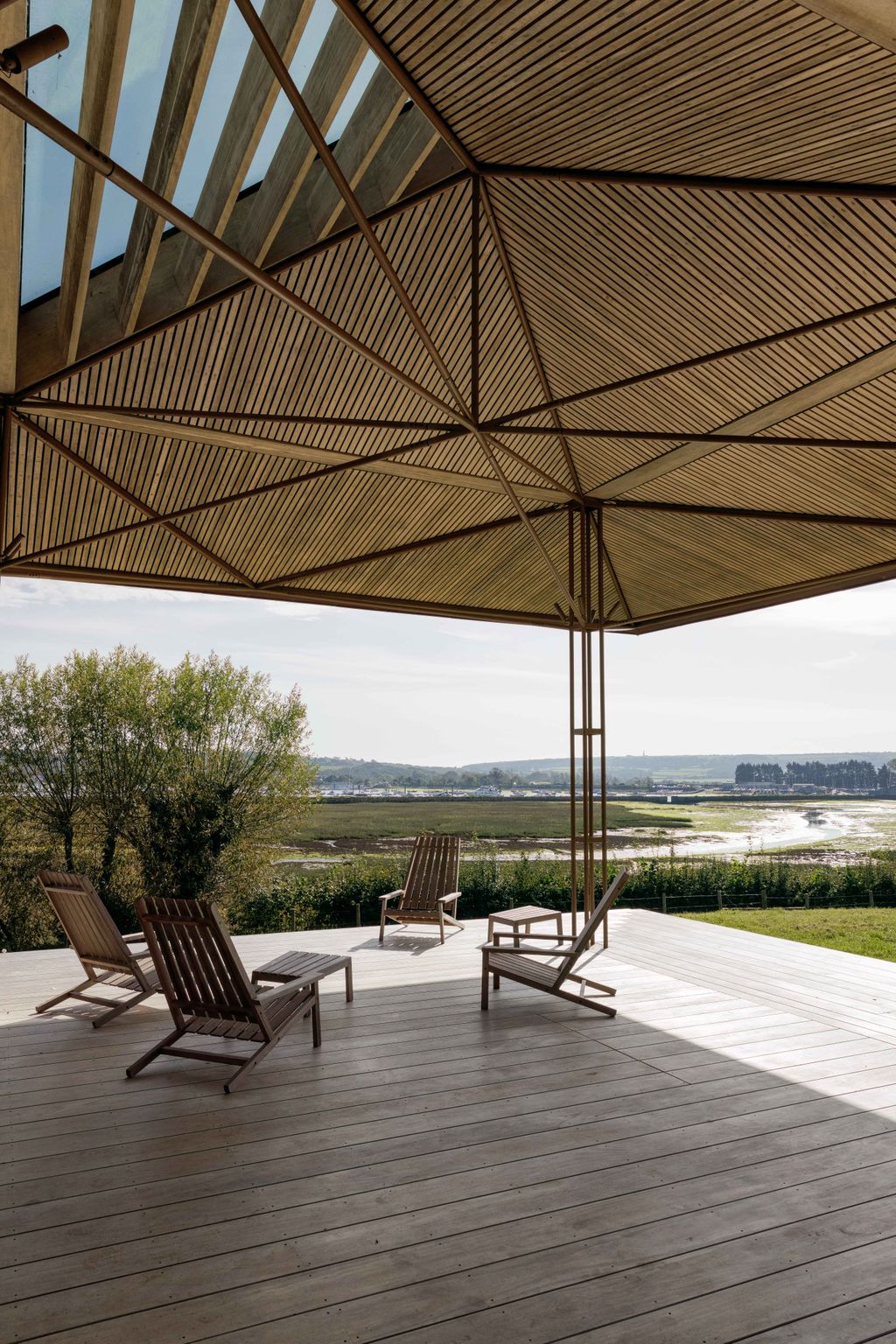 Image may contain Indoors Interior Design Chair Furniture Architecture Building House Housing Porch and Patio