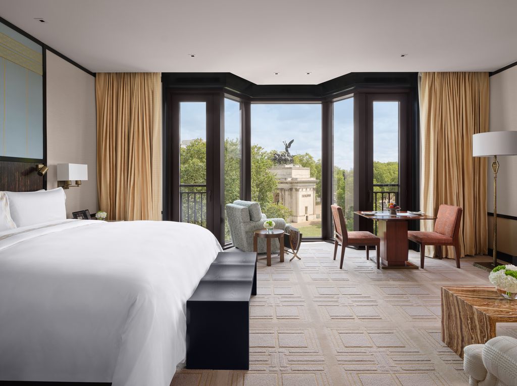 Image may contain Lamp Indoors Interior Design Chair Furniture Desk Table Window French Window Bed and Person