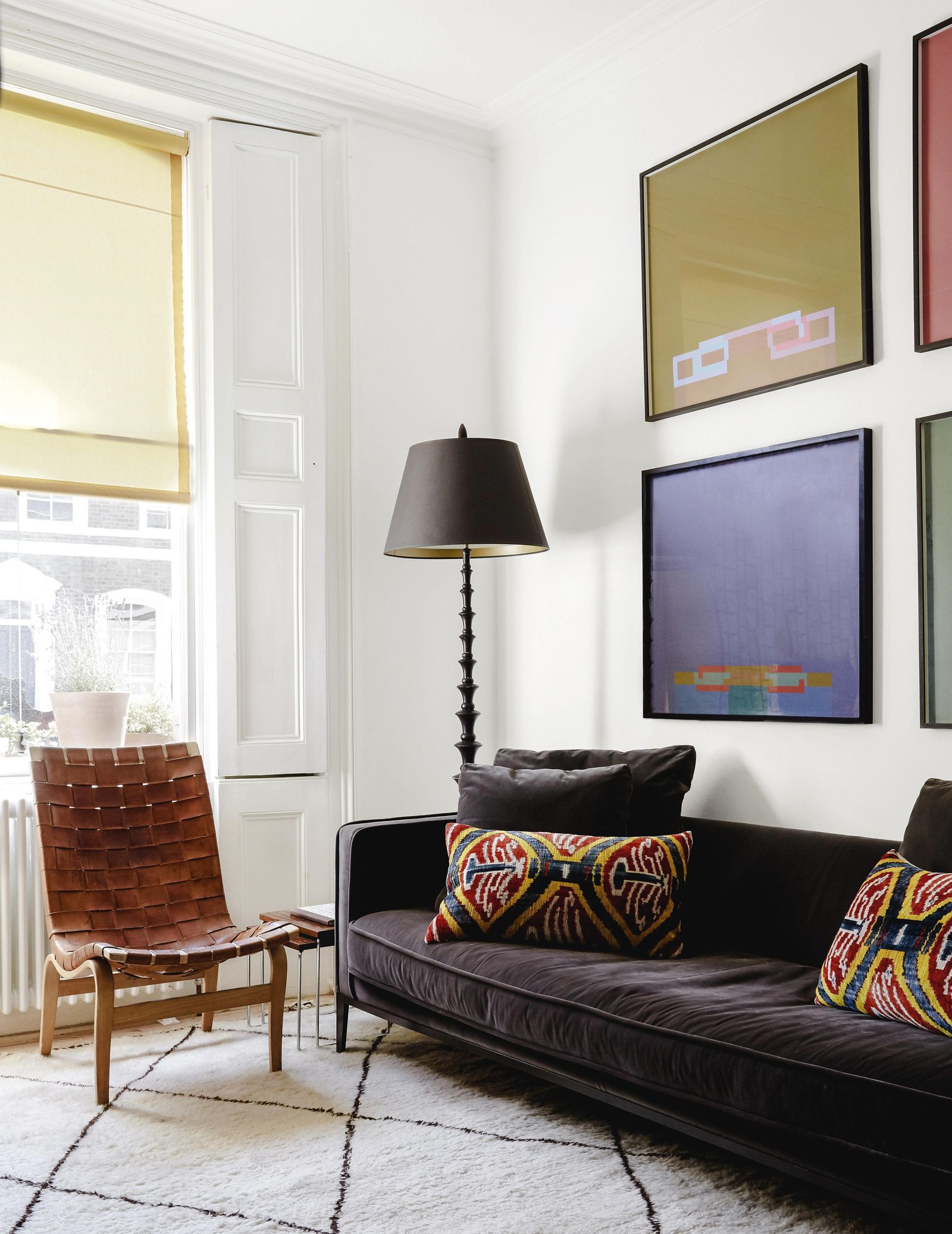 Image may contain Lamp Home Decor Couch Furniture Chair Rug Plant Computer Hardware Electronics and Hardware