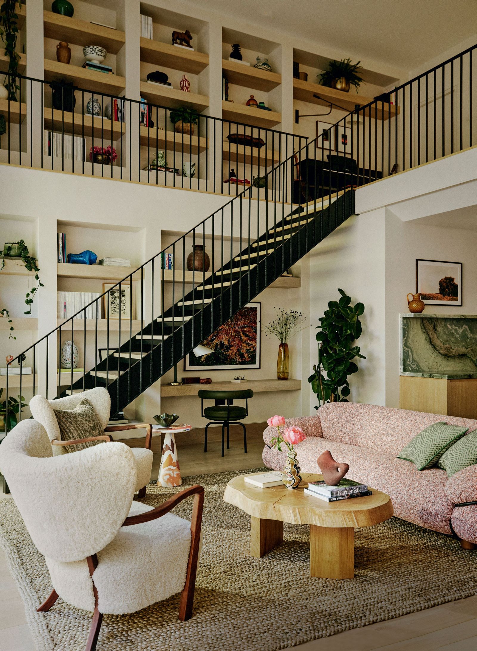 Image may contain Architecture Building Furniture Indoors Living Room Room Plant Couch House Housing and Staircase