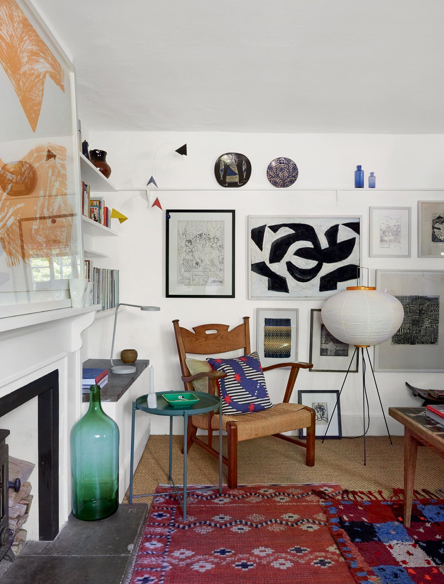 Image may contain Home Decor Chair Furniture Rug Architecture Building Indoors Living Room Room and Interior Design