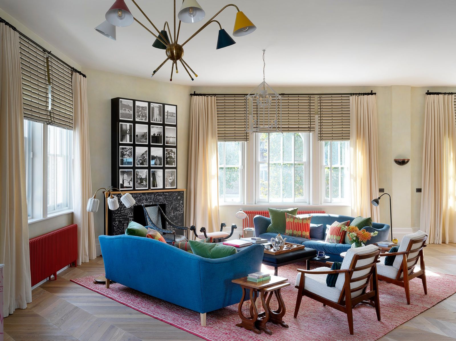 Image may contain Home Decor Chair Furniture Lamp Rug Table Couch Architecture Building Indoors and Living Room