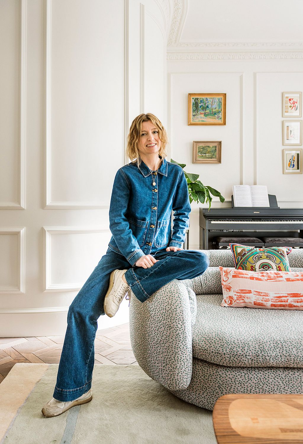 Image may contain Person Sitting Clothing Pants Keyboard Musical Instrument Piano Jeans Book and Publication