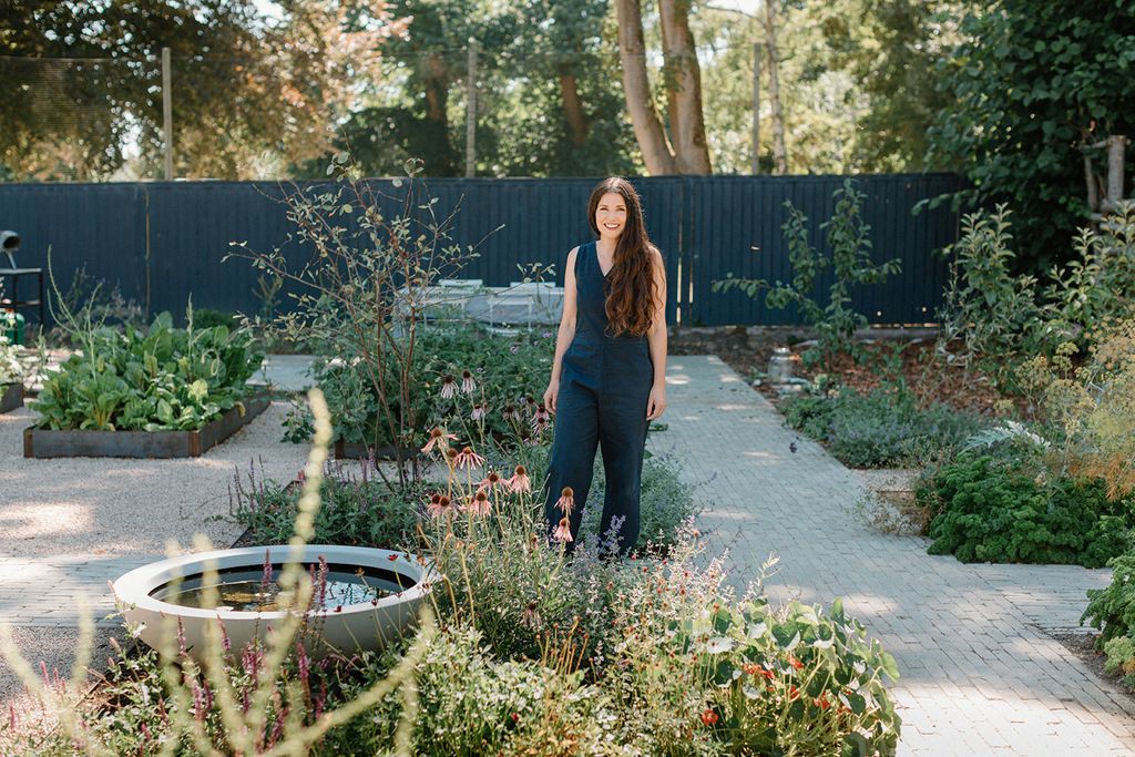 Image may contain Garden Nature Outdoors Backyard Yard Person Teen Clothing Pants Herbal Herbs Plant and Jar