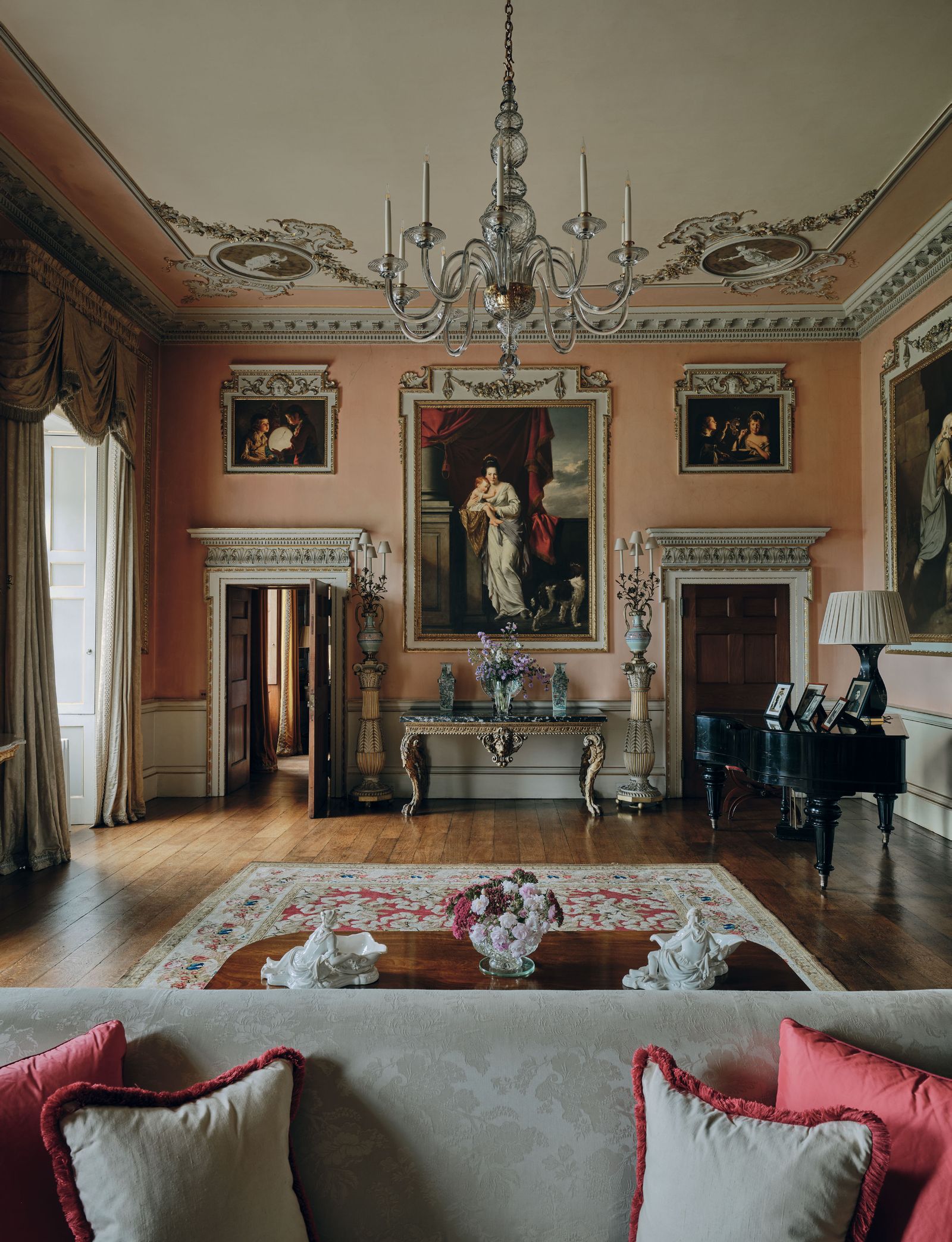 Image may contain Home Decor Chandelier Lamp Architecture Building Furniture Indoors Living Room Room and Keyboard