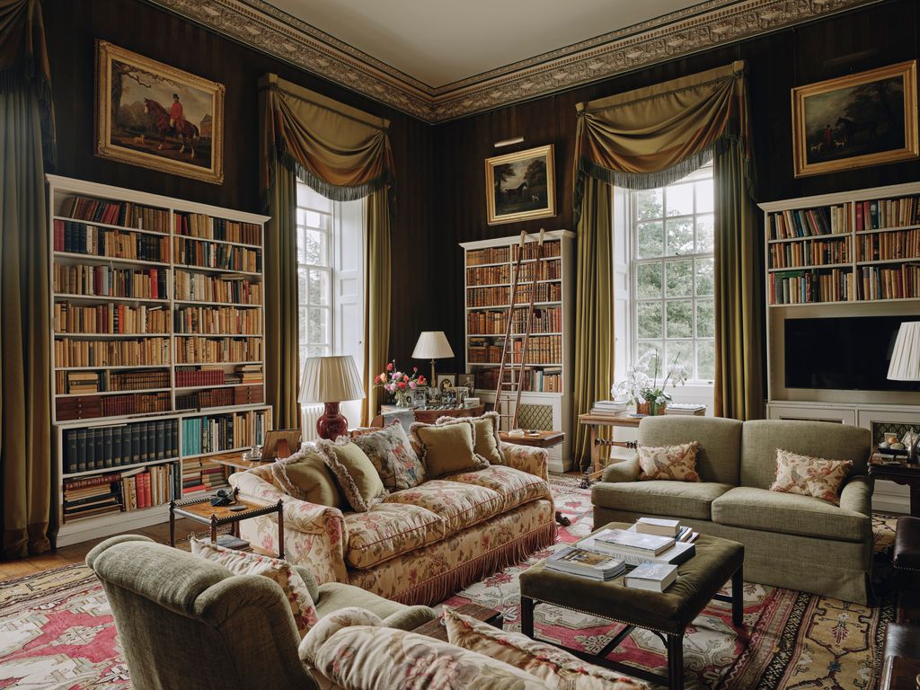 Image may contain Home Decor Couch Furniture Art Painting Book Publication Lamp Architecture Building and Indoors