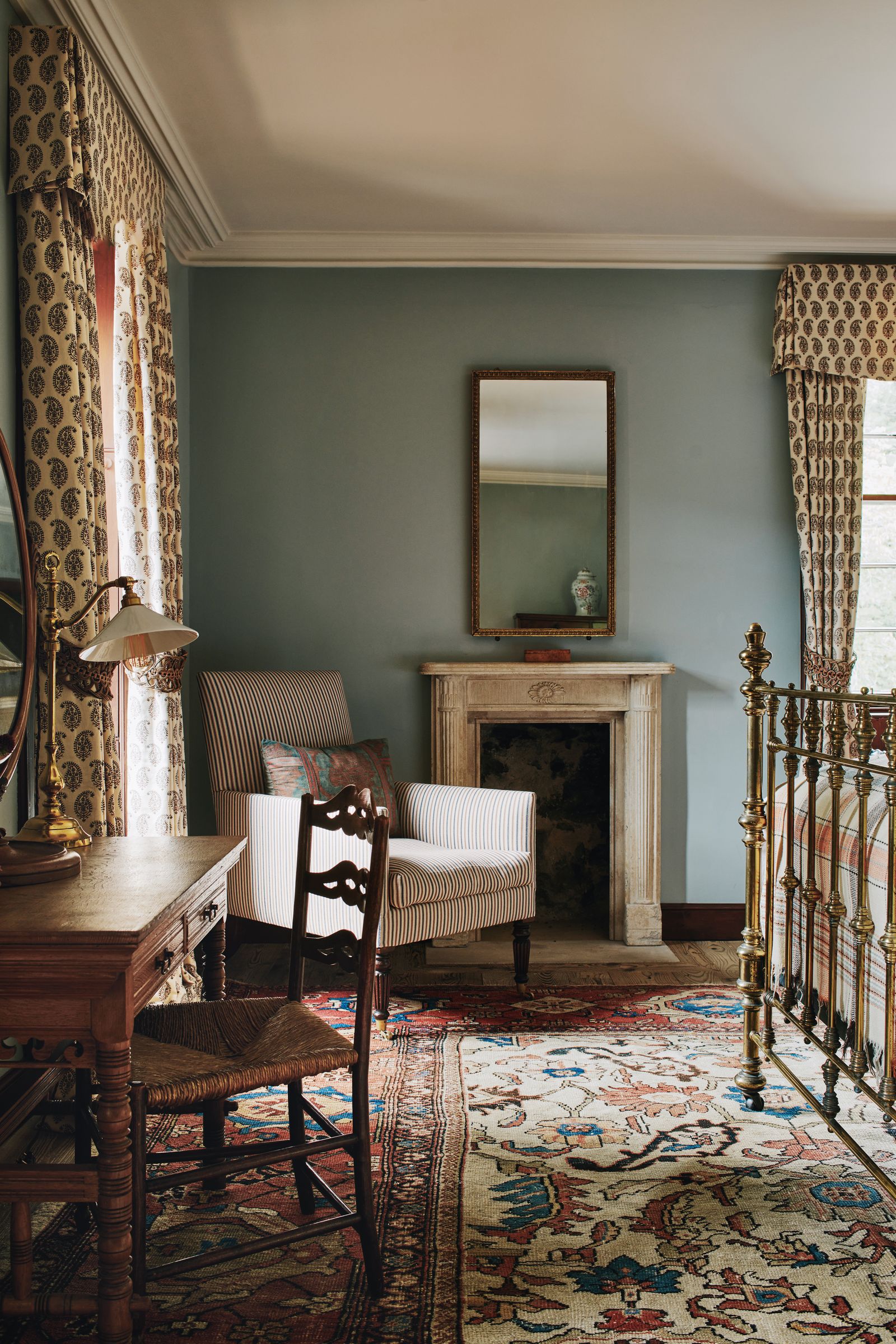 Image may contain Home Decor Chair Furniture Rug Architecture Building Indoors Living Room Room and Interior Design