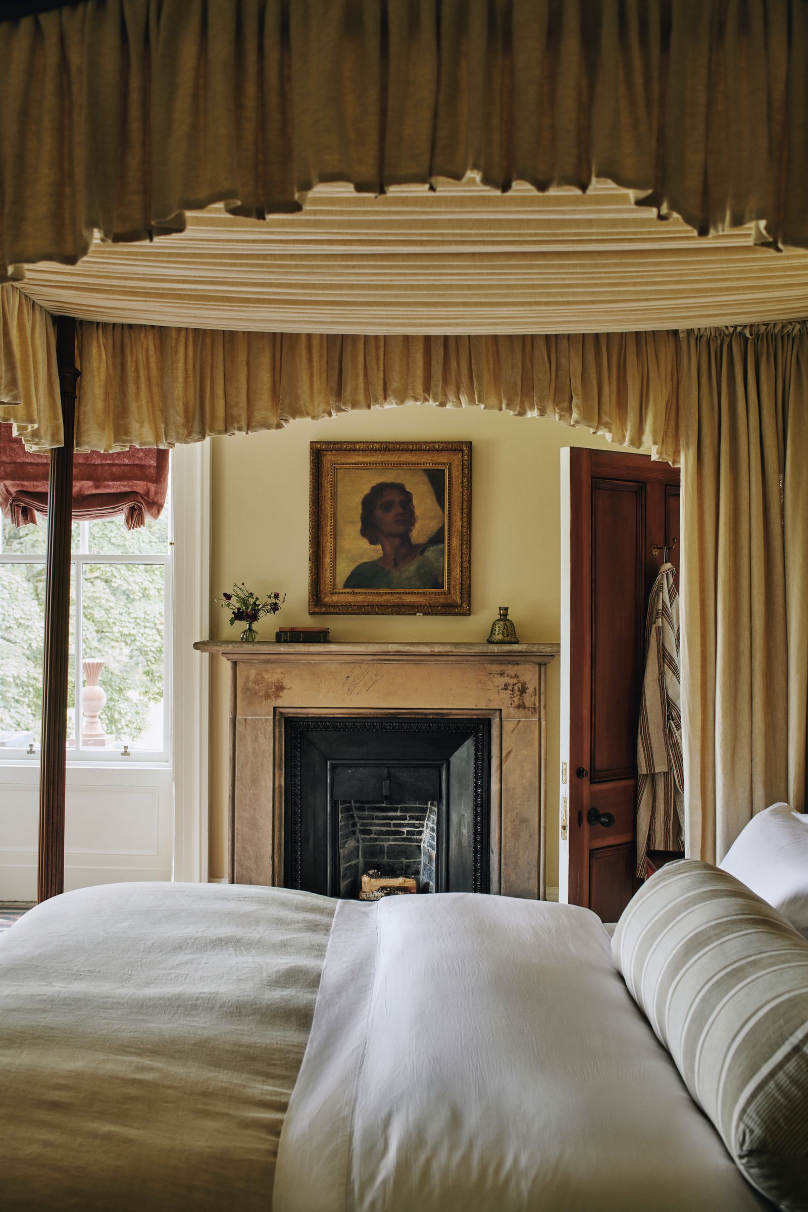 Image may contain Indoors Furniture Art Painting Bed Bedroom Room Person Fireplace and Canopy Bed