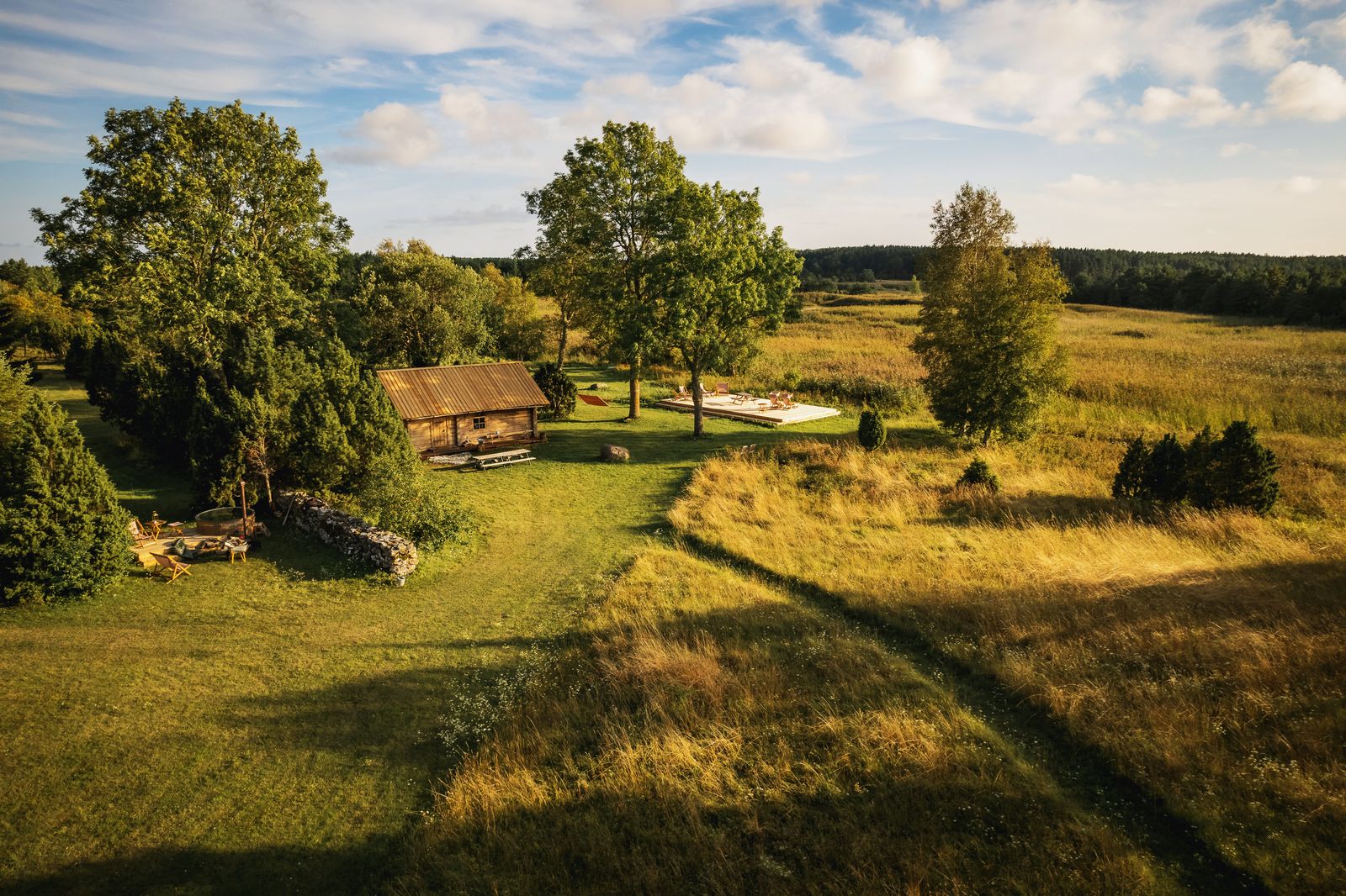 Image may contain Nature Outdoors Landscape Architecture Building Shelter Countryside Grass Plant Hut and Rural