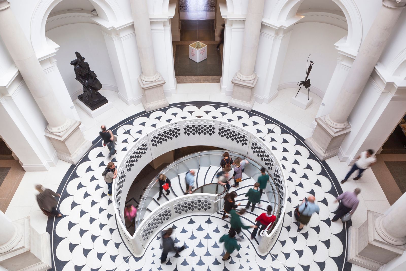 Image may contain Architecture Building House Housing Staircase Person Indoors Handrail Foyer Box and People