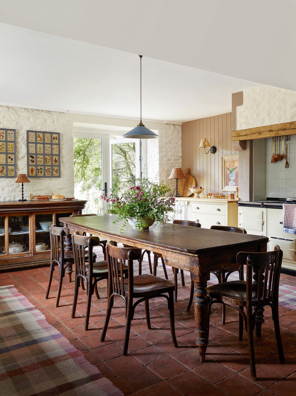 Image may contain Architecture Building Dining Room Dining Table Furniture Indoors Room Table and Lamp